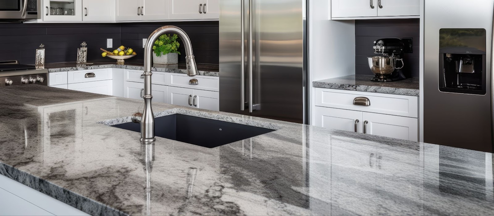 A modern kitchen with elegant marble countertops and sleek stainless steel appliances