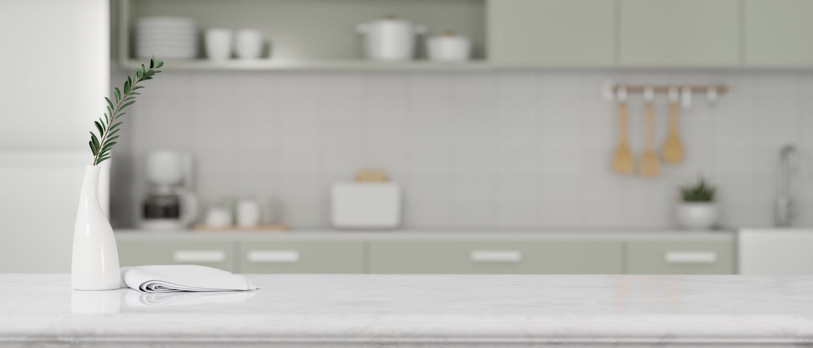 A white vase with a green plant enhances the kitchen's decor